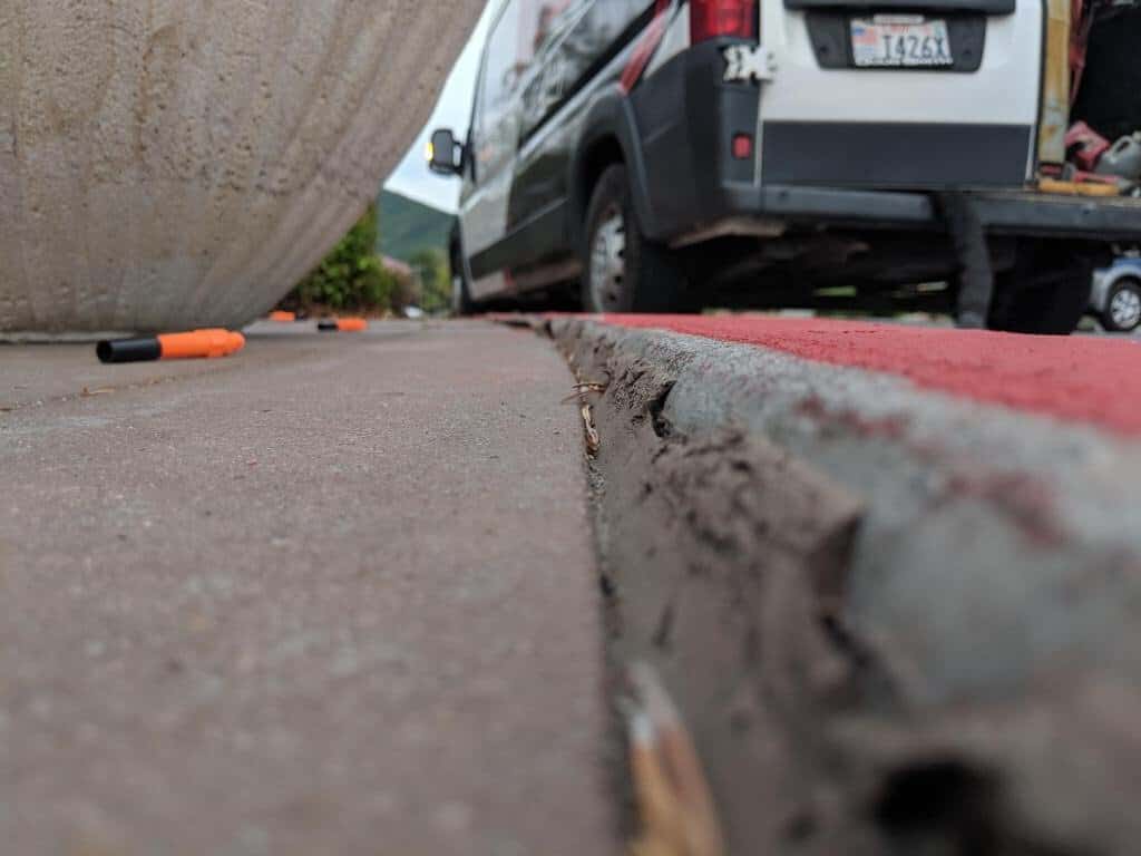 Concrete curb repair for parking lot safety and aesthetics.